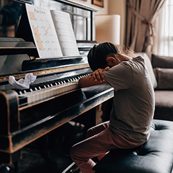 Child giving up piano after one try